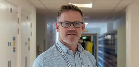 Alex Aarvold in a hospital corridor