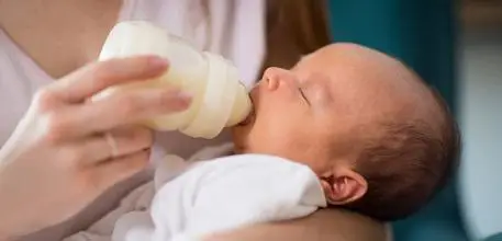 Baby being bottle fed