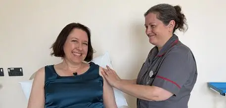 Bird flu vaccine trial participant with a nurse