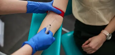 Person getting blood drawn from arm