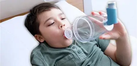 Boy with volumatic in hospital bed