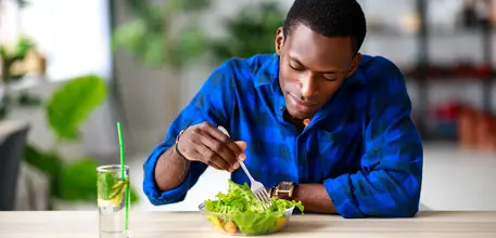 Man eating a salad