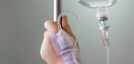Child's hand with a drip
