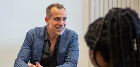 Chris van Tulleken speaking to a group of young people