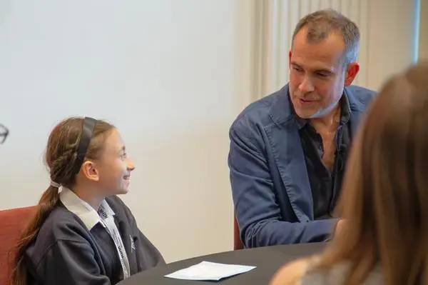 Chris van Tulleken speaking to a young girl