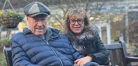 David Mather and his wife, Iwona sat on a bench outside