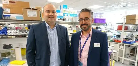 Dr Salah Mansour and Dr Ali Roghanian in a laboratory