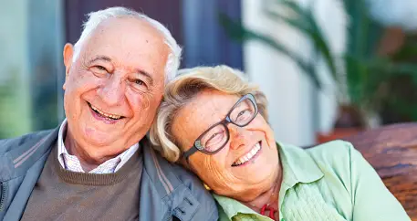 Elderly couple laughing