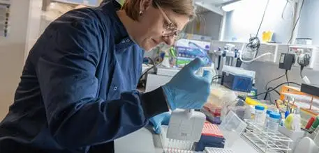 Dr Hannah Schiff working in a laboratory
