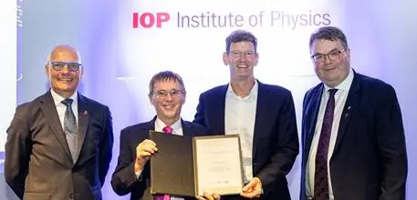 The team collecting their award