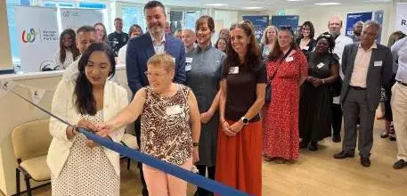 Satvir Kaur MP cuts the ribbon with the help from research participant Deborah 
