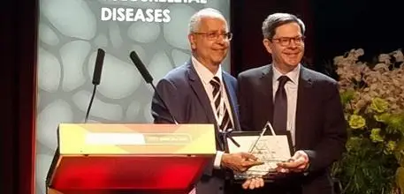 Prof Harvey collecting his award