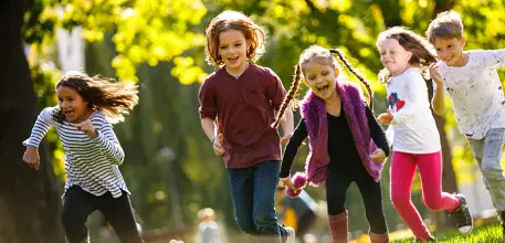 Group of children running outside