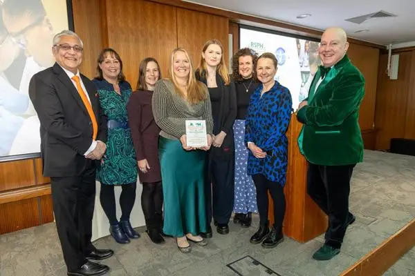 Group photo holding the award