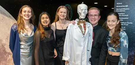 Group photo of young people with skeleton