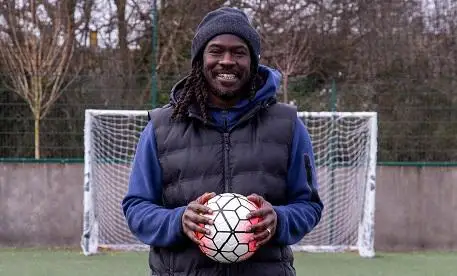 Linvoy Primus holding a football 