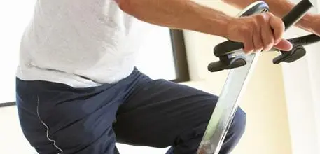 Older man on an exercise bike