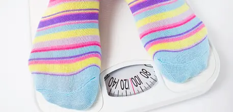 Colourful socks on weighing scales