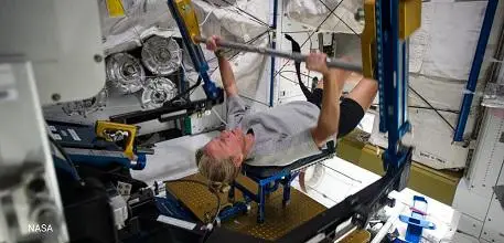 Astronaut exercising in space