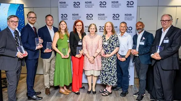 Professor Saul Faust and other winners with their NIHR Impact Prizes with Professor Lucy Chappell