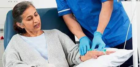 Nurse checking a patient's cannula
