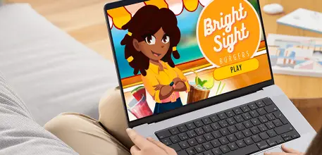 Person playing Bright Sight Burgers on a laptop