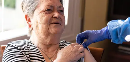 Elderly lady receives COVID-19 vaccine