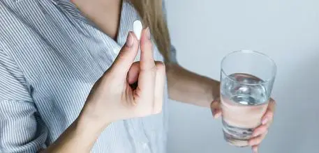 Woman taking a pill