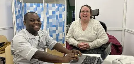 Alison Lamball seen during a clinic with Clinical Trials Assistant Nicholas Lukwago