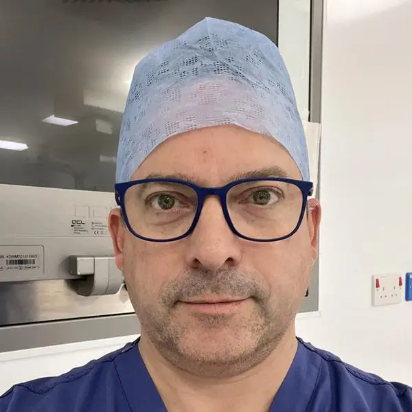 Tim Dudderidge wearing surgical scrubs