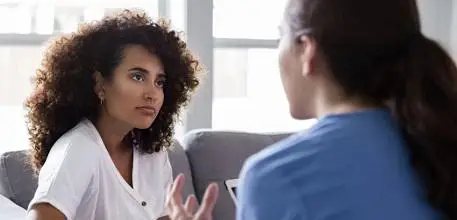 Two women having a serious conversation