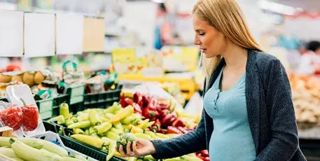 Pregnant woman in supermarket