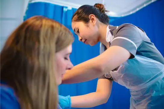 a nurse and a participant